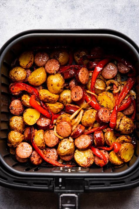 air fryer sausage and potatoes in the air fryer basket. Sausage Peppers Onions And Potatoes Air Fryer, Potatoes Air Fryer Recipe, Sausage Potatoes And Peppers, Potatoes Air Fryer, Potatoes In The Air Fryer, Sausage And Potatoes Skillet, Air Fryer Sausage, Air Fry Potatoes, Sausage And Potatoes