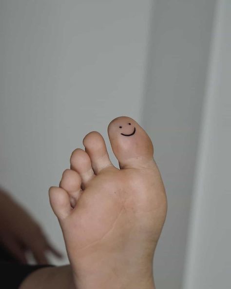 Underfoot Tattoo, Small Feet Tattoos For Women Simple, Funny Ankle Tattoo, Smiley Face Tattoo Ankle, Smiley Face Toe Tattoo, Bottom Of Toe Tattoo, Smiley Face Tattoo Toe, Bottom Of Foot Tattoo, Smiley Face On Finger Tattoo