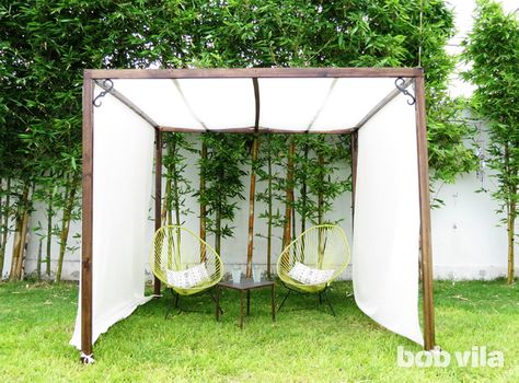 DIY privacy screen and canopy   Define your outdoor space, establish privacy, and even create some extra shade! Diy Patio Ideas, Diy Privacy Screen, Diy Gazebo, Backyard Shade, Backyard Canopy, Cheap Patio, Backyard Gazebo, Backyard Privacy, Patio Shade