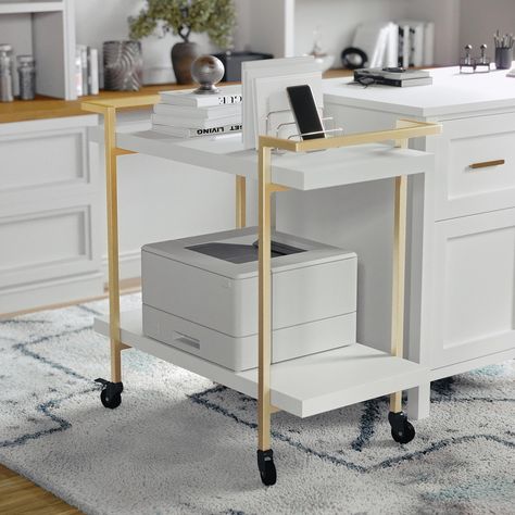 PRICES MAY VARY. Steel/Laminate Take your home office accessories anywhere you want to be with the Martha Stewart Liam 2-Tier Mobile Printer Cart Sturdy white melamine finish Engineered Wood shelves with side storage rails Durable steel frame in polished brass and locking caster wheels Assembly and Care Instructions: Quick and easy assembly with included tools and wipes clean with damp cloth Dimensions - 31.5"W x 16.25"D x 29.75"H; Shelf Size (2): 31.50"W x 14.25"D x 16.5"H; Maximum Static Weigh Printer Cart, Mobile Printer, Printer Stands, Wood Armoire, Office Printers, Mobile Office, Printer Stand, Salon Suites, Home Office Accessories