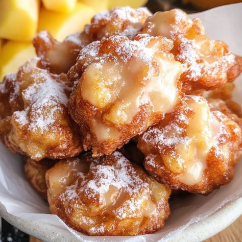 Easy Big Apple Fritters Recipe. Imagine crispy, golden-brown fritters packed with juicy apple pieces, coated in a sweet cinnamon glaze. This recipe is perfect for those cozy mornings when you Big Apple Fritters, Apple Fritters Recipe, Apple Fritter Cake, Baked Apple Fritters, Cinnamon Glaze, Apple Fritter, Fritters Recipe, Fried Apples, Fun Deserts