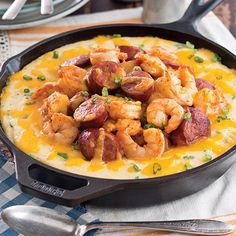 This Louisiana classic, Baked Creole Shrimp and Grits, is a flavorful dish with Andouille sausage, shrimp, cheese, spices, and butter. The traditional sausage in the recipe has a kick to it, so feel free to use a milder smoked sausage to keep the heat level down. Creole Shrimp And Grits, Shrimp Cheese, Creole Shrimp, Sausage Shrimp, Grits Casserole, Shrimp N Grits Recipe, Shrimp Creole, Grits Recipe, Shrimp And Grits