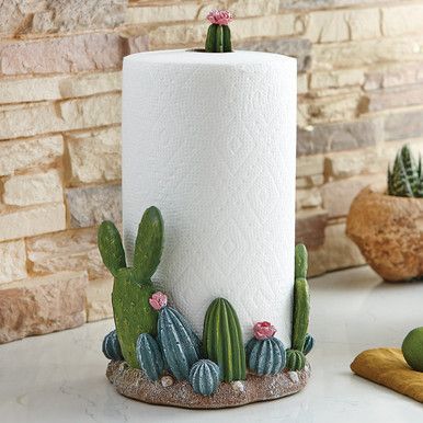 Exclusive Item - Add a touch of southwest style to your countertop with this polyresin paper towel holder featuring various blooming cacti.Padded Base Blooming Cactus Topper 7.5"W x 7.5"D x 13.75"H Polyresin Construction Ceramic Paper Towel Holder, Southwestern Kitchen, Rustic Island, Metal Paper Towel Holder, Blooming Cactus, Kitchen Paper Towel, Kitchen Paper, Tanah Liat, Keramik Design