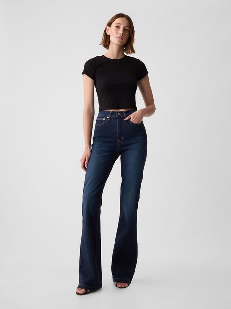 Fit: Snug & flattering through the hip & thigh with a flared leg. ​ Fabric: 86% Cotton, 13% Recycled Materials, 1% Stretch.  ��​ Stretch: Stretch Jeans.  A bit of hug & a lot of hold.  Comfortable & designed to flatter.  Rise: High Rise Jeans.  Look: A classic five-pocket jean in a dark wash.  Details: Zip fly, five-pocket styling & holds-you-in front pockets.  Responsibly Made: This pair of jeans is part of our water-saving Washwell program.  Compared to conventional wash methods, Washwell has sa Dark Washed Jeans Outfit, Wash Jeans Outfit, Flare Jeans Outfit, Jeans Look, Dark Denim Jeans, Dark Jeans, Dark Wash Jeans, High Rise Jeans, Look Cool