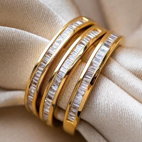 The Gold Baguette Eternity Diamond Band from Carrie Elizabeth is the ultimate stacking band! An absolute stunner that does not stop sparkling. The row of channel set baguette cut diamonds are meant to resemble an endless row of mirrors. Natural baguette cut diamonds .19 cts 14k gold vermeil plated Sterling silver base Dainty Gold Band, Eternity Diamond Band, Elizabeth Jewelry, Local Eclectic, Baguette Ring, Stacking Bands, Baguette Cut Diamond, Vermeil Jewelry, Eternity Band Diamond