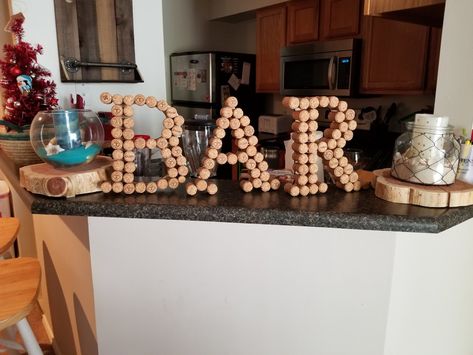 A BAR sign my fiance and I made with letters I cut out. She found a bunch of champagne corks to make this a great piece for our home. Champagne Corks, Wine Corks, Bar Area, Bar Sign, Bar Ideas, Bar Signs, A Bar, Garden Projects, Our Home