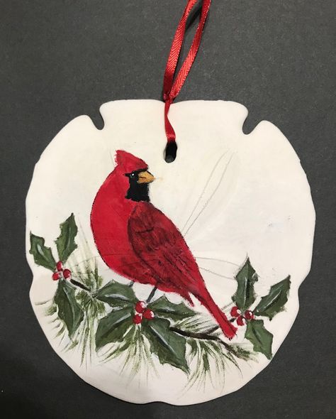 This large sand dollar with a hand painted cardinal is the perfect ornament for your Christmas tree or Christmas display. (Yes, it is a real sand dollar !) A meaningful gift for friends who treasure the significance of this beautiful red bird. Cardinal Xmas Decor, Sanddollar Ornaments Diy, Painted Cardinal, Painted Sand Dollars, Sand Dollar Craft, Dollar Art, Sand Dollar Art, Nautical Christmas Ornaments, Christmas Orniments