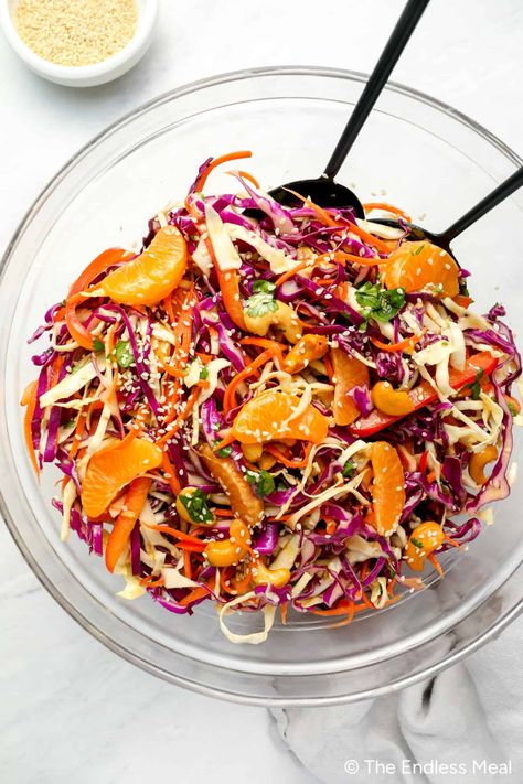 This 20-minute Asian coleslaw will be a hit. It's colorful, vibrant, refreshing, and packed with delicious flavors. An array of nutritious veggies and mandarin oranges are tossed in the most divine orange sesame dressing. #theendlessmeal #salad #coleslaw #dinner Recipes With Mandarin Oranges, Asian Coleslaw Recipe, Chinese Cabbage Salad, Mandarine Recipes, Salad Coleslaw, Asian Cabbage Salad, Asian Cabbage, Asian Chopped Salad, Asian Salad Recipe