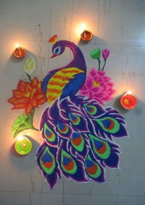 Diwali peacock rangoli Rangoli Designs Diwali Peacock, Rangoli Making, Rangoli Peacock, Diwali Home Decor, Happy Diwali Rangoli, Lotus Rangoli, Peacock Rangoli, Festival Rangoli, Diwali Decoration