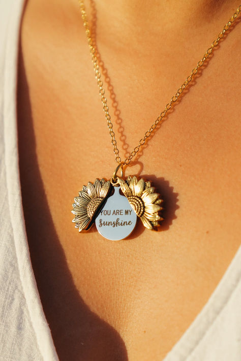 Get this You Are My Sunshine necklace, a perfect gift for your bestfriend, mom, sister or girlfriend. This necklace is crafted by artisans on metal and message “You are my sunshine” hidden in sunflower locket necklace. #bestfriends #sunshine #cute #giftsforher #bonding #love #sunflower #necklace Box Of Sunshine, Sunshine Necklace, Creative Birthday Gifts, Sunflower Gifts, Sunflower Necklace, Get Well Soon Gifts, Birthday Gifts For Best Friend, My Sunshine, Christmas Gifts For Women