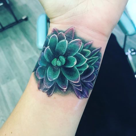 Succulent wrist tattoo Colorful Wrist Tattoos, Succulent Tattoo Meaning, Small Tattoo Ideas Flower, Tattoo Ideas Succulents, Succulent Sleeve Tattoo, Succulent Sleeve Tattoos For Women, Tattoo Ideas For Men Back, Succulent Tattoo Ideas, Minimalist Tattoo Back