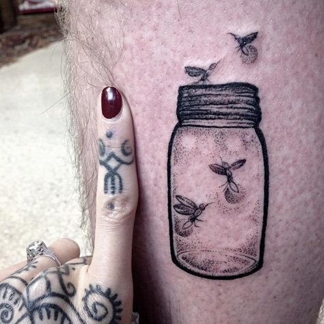 fireflies in a jar tattoo by hannah snowdon Jar Tattoo, Firefly Tattoo, Small Doodles, Lantern Tattoo, Fireflies In A Jar, Mystical Tattoos, Flying Tattoo, Finger Tattoo For Women, Bug Tattoo