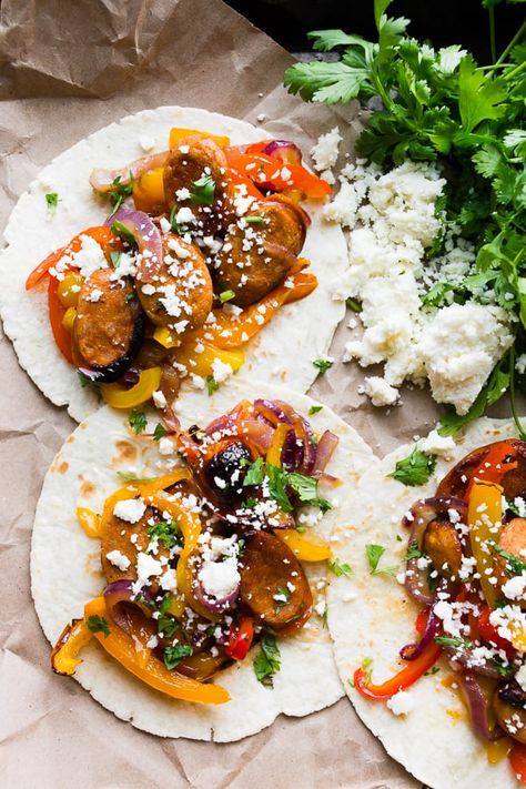 Sheet Pan Chicken Sausage Fajitas | Nutmeg Nanny Sausage Fajitas, Homemade Fajita Seasoning, Sheet Pan Chicken, Sweet Peppers, Fajita Seasoning, Cotija Cheese, Pan Chicken, Homemade Seasonings, Red Onions