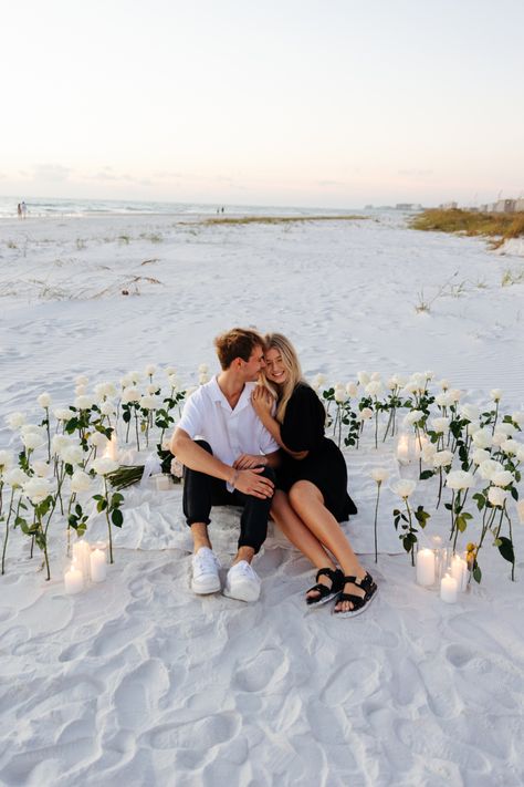 White Roses And Candles Proposal, Propose On The Beach, Beach Proposal White Roses, Diy Beach Proposal, Beach Engagement Decor, Engagement At The Beach, Florida Proposal Ideas, Engagement Proposal Ideas Beach, Beach Wedding Proposal Ideas