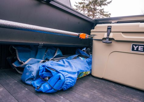 Maximize your truck's storage space with efficient cargo management using the Peragon cover. It conveniently retracts into the front 6-8 inches of your truck bed, which means you don’t have to worry about a permanently mounted canister taking up precious space. ㅤ Using a straightforward cargo hook, you can easily move items in and out of this formerly wasted space. Say goodbye to awkward, unreachable corners in your truck bed and fully utilize every square inch you have. ㅤ In situations where... Truck Storage, Truck Bed, Safety And Security, Cool Tools, Say Goodbye, Storage Space, No Worries, Storage Spaces, Square