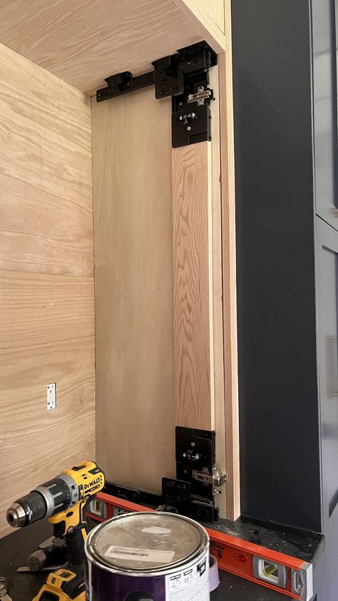 DIY Cabinet with Pocket Doors - findmaggiemay.com Cabinet With Pocket Doors, Pocket Doors Diy, Diy Pocket Door, Sliding Cabinet Doors, Bedroom Built Ins, Diy Cabinet Doors, Diy Cabinet, Wall Storage Cabinets, Office Built Ins