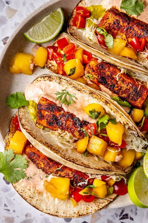 BLACKENED FISH TACOS WITH MANGO SALSA Mango Fish Tacos, Tacos Steak, Fish Tacos With Mango Salsa, Easy Entrees, Apartment Recipes, Seasoned Sour Cream, Tacos With Mango Salsa, Blackened Fish Tacos, Blackened Fish