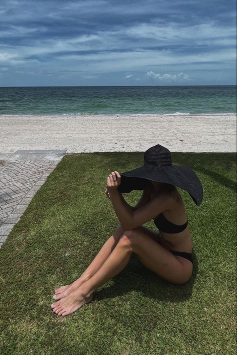 Woman sits on green grass in front of beach with ocean in the back. She has on an oversized black round straw beach hat that covers her face. She is sitting with her knees up and toes pointed in the grass. Big Beach Hat, Beach Straw Hat, Wide Brim Straw Hat, Girls Travel, Sun Hats For Women, Hat For Women, Beach Hat, Black Hat, Sun Hat