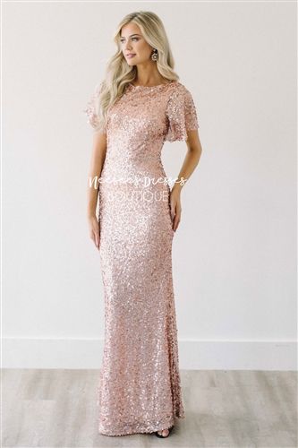 We can't put into words how breathtaking this dress is! We promise you won't want to let it pass you by! The Aurora is the epitome of perfection in a gown! Stunning, rose gold sequin full length dress features ruffle sleeves, a mermaid fit. Gold Sequin Gown, Aurora Rose, Rose Gold Sequin Dress, Neesees Dresses, Silver Sequin Dress, Bridesmaid Dresses With Sleeves, Sequin Bridesmaid, Sequin Bridesmaid Dresses, Lace Bridesmaids