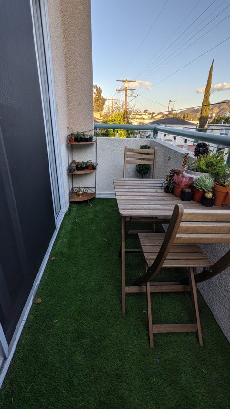 An empty patio I put turf on as well as a patio set. Turf Apartment Balcony, Grass Turf Balcony, Turf Balcony Ideas Apartment, Outdoor Turf Patio, Turf Porch Ideas, Turf Patio Ideas Apartment, Balcony Turf Ideas, Turf On Patio, Balcony With Turf