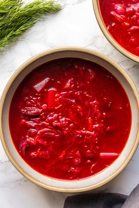 If you've ever wanted to try Ukrainian Borscht, you've come to the right place. In this ultimate guide I'm sharing all tips and tricks on how to make the best vegan Borscht ever. As a native Ukrainian I had Borscht every week prepared by my mom and grandma. It's so delicious and easy yet there are some things to keep in mind. I'm spilling all secrets in my blog post. Step-by-step recipe as well as video are included. Potato On The Grill, Cabbage And Beans, Potato Instant Pot, Classic Borscht Recipe, Potato Dinners, Vegan Borscht, Potato In The Oven, Recipe With Cabbage, Borscht Recipe