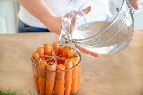 HOW TO CREATE A CUTE EASTER CARROT FLOWER ARRANGEMENT | Everyday Laura Carrot Decorations For Easter, Carrot Flower Arrangement, Bunny Flower Arrangement, Carrot Decor, Mason Jar Flower Arrangements, Easter Centerpieces Diy, Bunny Flower, Carrot Flowers, Easter Flower Arrangements