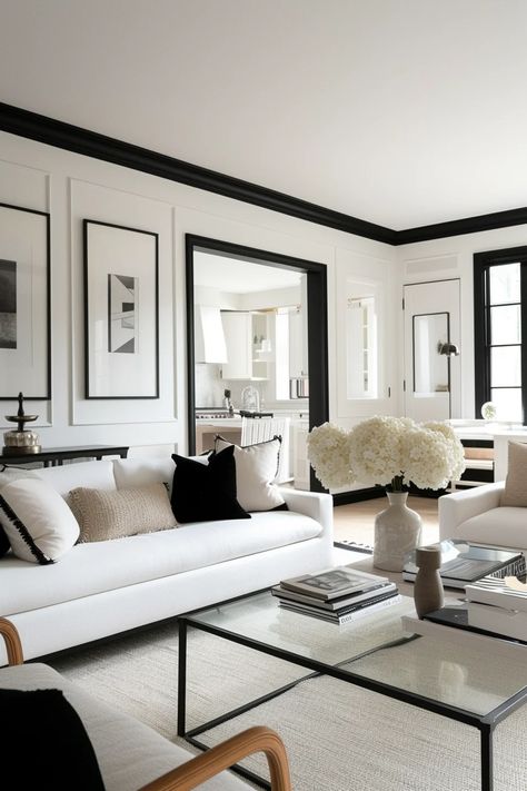 13 Chic Room Ideas Featuring White Walls With Black Trim White House With Black Trim Interior, Black White Modern House, Dark Floor White Walls Living Room, White And Black Living Room Aesthetic, Black And White Family Room Ideas, Black And White Luxury Living Room, White Room Black Ceiling, Black Moldings And Trim Living Room, Black Cream White Living Room