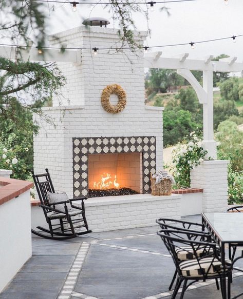 A white brick outdoor fireplace that I think we would all love to sit by tonight! 🔥 @lauraandthegs outdoor space is so cozy and welcoming.… Brick Outdoor Fireplace, Outdoor Patio Fireplace, Outdoor Fireplace Brick, Fireplace Outside, Fireplace Plans, Deck Hot Tub, Outdoor Fireplace Ideas, Outdoor Fireplace Plans, New Patio Ideas