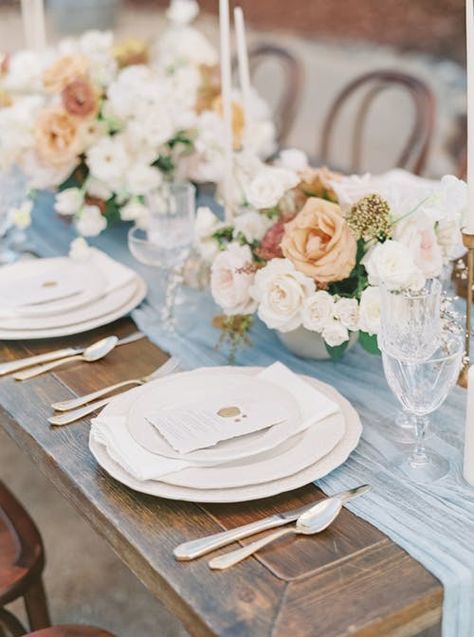 Stunning estate wedding with sheer baby blue runners topped with breathtaking floral arrangements and chic candlesticks. Wood furniture and a natural outdoor setting topped of the beautiful design. Table Floral Arrangements, Fair Photography, Luxury Weddings Reception, Romantic Wedding Inspiration, Tuscan Inspired, Tablescape Inspiration, Wedding Reception Inspiration, Luxury Destination Wedding, Wedding Reception Tables