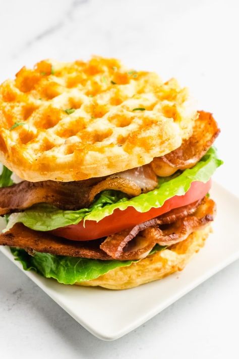 Try this delicious Keto BLT sandwich made with Chaffle "bread".  With all of that crispy bacon, juicy tomato, and fresh lettuce, you won't miss the carbs at all!  Chaffle BLT sandwiches are the best new low-carb lunch idea! Chaffle Recipes Easy Breakfast, Chaffle Recipes Easy, Chaffle Breakfast, Chaffle Bread, Keto Blt, Chaffle Sandwich, Low Carb Chaffle, Blt Sandwiches, Easy Breakfast Sandwich