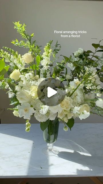 NYC Wedding and Events Florist on Instagram: "Every florist I know has their own library of tips and tricks. And they all work well. These served me well 19 years and counting:
1. Use willow branches to bend/loop to make a grid inside the vase and feel good about being more green 💚
2. My sprite + bleach combo - Video explains why
3. Woody branches and stems - split the bottom using your shears, while your shears are inside the stem twist your wrist. Watch to see how it’s done. This helps drink more water
4. Balance the blooms and let each flower breathe
5. Like share and follow for more flower arranging 🤩 

#flowerarranging #nycflorist #floristsofinstagram #spring #tulips #rachelchofloral" Diy Floral Table Centerpieces, How To Make Floral Arrangements, How To Make Flower Arrangements, How To Arrange Flowers In A Vase, Flower Arranging Videos, Flower Arragement, Tulip Arrangement, Diy Flower Arrangements, Nyc Florist