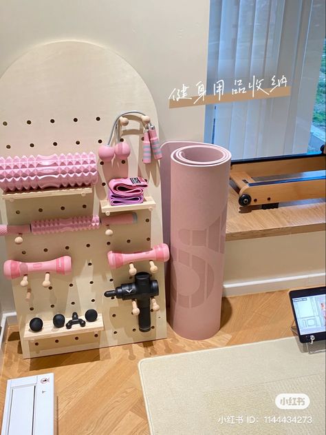 Pink Exercise Equipment, Tiny Pilates Studio, At Home Workout Area, Bedroom Wall Storage Ideas Space Saving, Activewear Organization, Workout Area In Bedroom, Pilates Storage, Tiny Gym, Workout Supplies