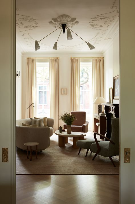 Joan Enger has a passion for restoring historic homes. With a unique ability to balance contemporary elements with classic inspiration, she creates timeless, livable interiors. This living room features an oversized chandelier, herringbone floors, and airy window treatments. Book a 1:1 video consultation with Joan Enger on The Expert and get personalized interior design advice for your space. Hausmann Interior, Airy Window Treatments, Oversized Chandelier, Herringbone Floors, Room Furniture Design, Online Consultation, Art Deco Interior Design, Interior Design Advice, Contemporary Elements