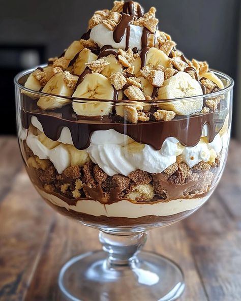 🍫 Chocolate Peanut Butter Banana Cream Trifle 🍌🥜 Layers of chocolate, peanut butter, and bananas come together in this creamy, decadent trifle! Ingredients: For the Chocolate Layer: 1 box (3.9 oz) instant chocolate pudding mix 2 cups cold milk For the Peanut Butter Layer: 1 cup creamy peanut butter 8 oz cream cheese, softened 1 cup powdered sugar 1 teaspoon vanilla extract 1 cup whipped cream or whipped topping For the Banana Layer: 3-4 ripe bananas, sliced For the Whipped Cream: 1 cup... Banana Cream Trifle, Trifle Dessert Recipes, Dessert Bar Wedding, Ripe Bananas, Banana Cream, Fun Baking Recipes, Peanut Butter Banana, Whipped Topping, Chocolate Pudding