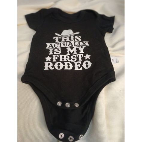 Saddle Up For Cuteness Overload With This Charming Black Baby Bodysuit! Featuring The Witty Phrase 'This Actually Is My First Rodeo' In Bold White Lettering, Complete With A Cowboy Hat Graphic. Perfect For Your Little Buckaroo's First Western Adventure Or Everyday Wear. Made From Soft, Comfortable Fabric With Convenient Snap Closures. Size 6m For Growing Cowboys And Cowgirls! Cowboy Hat Graphic, Baby Pineapple, Rodeo Baby, Cat Onesie, Orange Baby, Navy Baby, Bodysuit Top