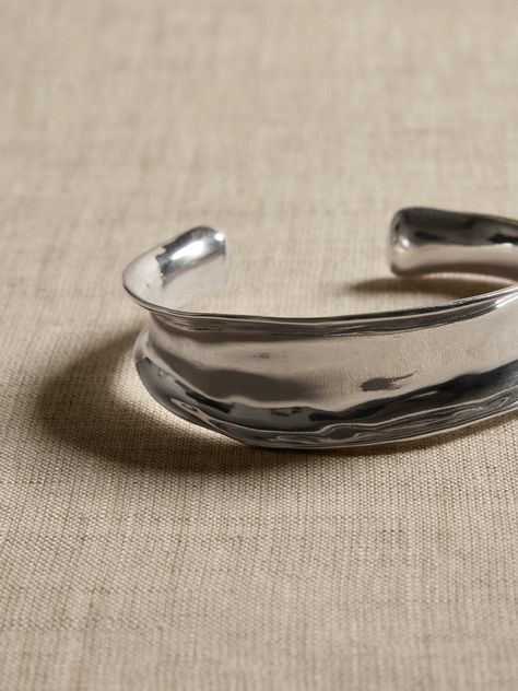 The peaks and valleys of mountainous regions inspired the design of this sinuous silver-plated brass cuff.  Stack several for stylish impact.  Mixed Metals: Elevate and modernize your jewelry pairings with dynamic mixed metal and golden tone or silver-plated pieces meant for layering.  Silver-plated brass.  Made in India.  Interior diameter: 2. 5" Cuff width: 0. 75" Silver Arm Cuff, Peaks And Valleys, Silversmithing Jewelry, Silver Jewlery, Metal Cuff Bracelet, Brass Cuff, Dope Jewelry, Stacked Jewelry, Jewelry Lookbook