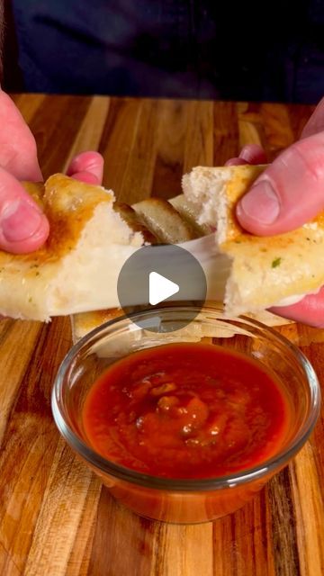 Bryan Dalton on Instagram: "Cheesy Breadsticks  These were so quick and easy… You’ve gotta try em  Start to finish in 15 minutes!  Start by rolling out your dough or just getting some premade from the store. Place on Parchment paper and separate your mozzarella cheese sticks on the dough giving yourself at least a 1/2” gap. Use egg wash on the edges and between the cheese sticks. Fold your dough over the cheese and press down firmly along the edges and between the sticks of cheese. Cover the dough in more egg wash. Bake at 425° for 10 minutes or recommended temperature/time. Once done, cover in herb butter. Slice into your individual cheese sticks and serve with marinara or your favorite dipping sauce!  #cheesy #pizzadough #cheesesticks #cheesybread #cheesebread #appetizers #foodlover #bak Easy Cheese Breadsticks, Easy Cheese Bread Sticks, Cheese Sticks With Pizza Dough, Easy Cheesy Breadsticks, Smoked Pork Tenderloin Recipes, Cheese Bread Sticks, Cheesy Breadsticks, Mozzarella Cheese Sticks, Easy Cheese