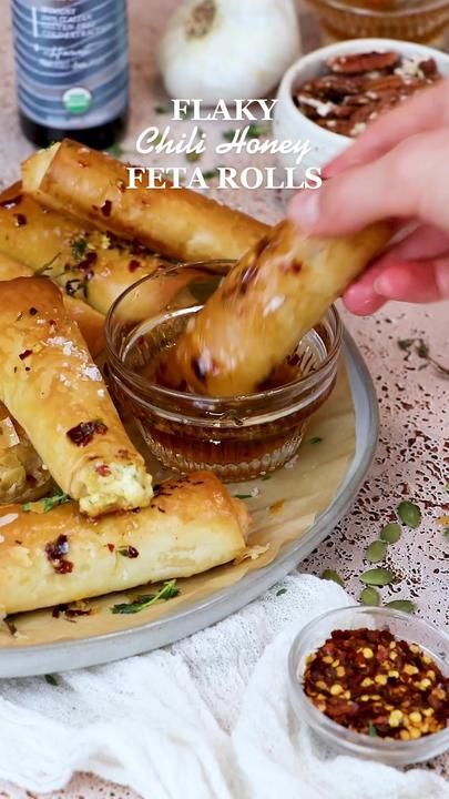 recipe coming tomorrow! #fetarecipes #phyllodough #fetacheese #healthy... | feta rolls | TikTok Honey Feta, Feta Rolls, Philo Dough, Chili Honey, New Years Eve Snacks, Phyllo Dough Recipes, Holiday Appetizers Recipes, Feta Recipes, Appetizers Easy Finger Food