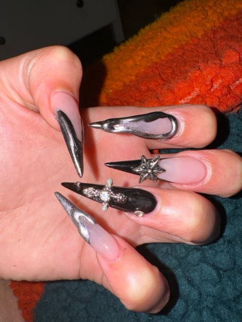 stiletto chrome and black nails with gems Chrome And Black Nails, Stiletto Nails With Gems, Stiletto Chrome Nails, Black Nails With Gems, Nails Ideas Stiletto, Nails With Gems, Black Stiletto Nails, Ken Carson, Chrome Nails