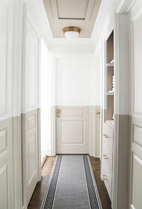 Raise your brush if you love this color block. Us, too! Sarah from @roomfortuesday used two Sherwin-Williams paint colors, Extra White SW 7006 and Amazing Gray SW 7044, for this hallway and built-in closet renovation that’ll surprise all of her guests. Click through to see more pictures of this stunning scene. Linen Closet Makeover, Half Painted Walls, Hallway Paint, Design Hall, Choosing Paint, Work Trip, Attic Bathroom, Hallway Designs, Hallway Design