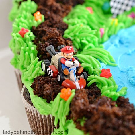 Mario Kart Cupcake Pull Apart Nintendo Switch Pull Apart Cupcakes, Mario Kart Desserts, Super Mario Pull Apart Cupcake Cake, Mario Birthday Cupcake Cake, Mario Race Track Cake, Mario Pull Apart Cupcakes, Super Mario Cupcake Cake, Mario Kart Cupcakes, Bowser Cupcakes