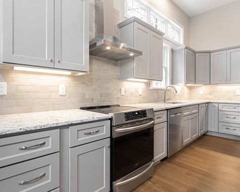 They say the kitchen is the heart of the home and we couldn't agree more. This modern kitchen is perfect for all of your culinary endeavors. The sleek gray cabinets, stainless steel appliances, and neutral tile backsplash create a timeless look. #dreamhomedesign #wakecountync #raleighhomes #carync Kitchen Ideas With Silver Appliances, Neutral Tile, Gray Cabinets, Steel Appliances, Grey Cabinets, Remodels, Updated Kitchen, Stainless Steel Appliances, Tile Backsplash