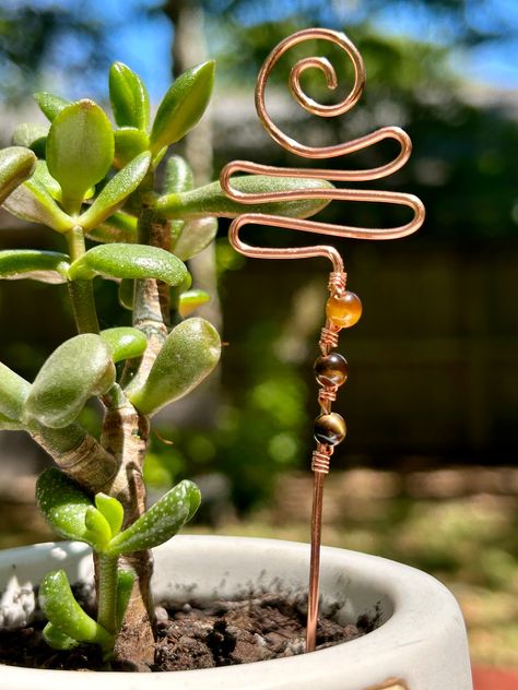 Tiger’s Eye Gemstone Wire Wrapped Copper Plant Stake Decor Copper Coil Projects, Crafts With Copper Wire, Beaded Plant Stakes Wire, Bead Garden Art, Wire Wrap Plant Stake, Copper Wire Wrapped Rocks, Gem Wire Wrapping, Beaded Plant Stakes Diy, Copper Wire Gardening