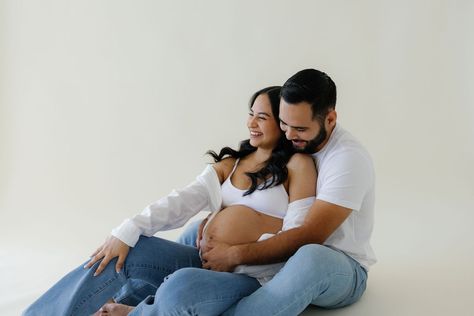 Maternity Photoshoot in a studio. White tops and jean trend. All images belong to ajphotography760. Email: ajphotography760@gmail.com Jean Maternity Shoot Couple, Blue Jean Maternity Pictures, Motherhood Photoshoot, Spring Maternity Photos, White Top And Blue Jeans, Maternity Shoot Dresses, Studio Maternity Shoot, Maternity Studio Photoshoot, Pregnancy Announcement Photoshoot