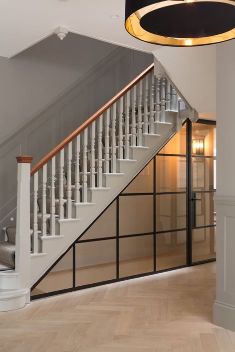 Staircase With Glass Wall, Glass Enclosed Staircase, Glass Partition Stairs, Under The Stairs Ideas, Stair Case Glass Designs, Glass Elevator With Stairs, Office Under Stairs, Kitchen Under Stairs, Under Stairs Wine Cellar