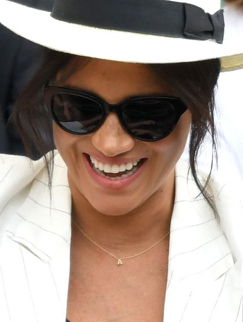 Meghan Markle Cheers On Serena Williams At Wimbledon, Wears Adorable Archie Necklace | ETCanada.com Kourtney Kardashian Cross Necklace, Kourtney Kardashian Sunglasses, Rihanna Jewelry Necklaces, Celebrity Necklace, Royal Engagement Rings, Estilo Meghan Markle, 14k Gold Initial Necklace, Tom Ford Sunglasses Celebrity, Sideways Initial Necklace