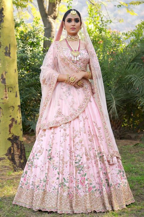 Lehenga is a delicate pink color with heavy embellished work worn with pale peach color odhni and a silver choli घाघरा चोली, Pink Bridal Lehenga, Orang India, Pengantin India, Wedding Lehenga Designs, Bridal Lehenga Collection, Designer Bridal Lehenga, Indian Bridal Lehenga, Bridal Lehenga Red