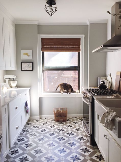 The kitchen is the heart of my home. It's large by NYC standards (about 13" x 9"), and it's where I spent most of my budget. Cement tile + reclaimed NYC scaffolding wood shelves + a farmhouse sink = this girl's bliss. Prewar Apartment, 1918 House, Scaffolding Wood, Guest Bedroom Remodel, Kids Bedroom Remodel, Retro Kitchens, Small Bedroom Remodel, Manhattan Apartment, Freestanding Kitchen