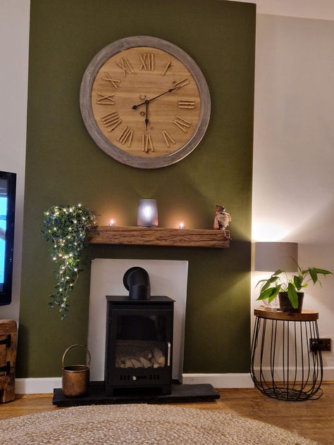 green fireplace Olive Coloured Living Room, Dark Green Small Living Room, Cosy Snug Room Ideas Log Burner, Calm Colors For Living Room, Green Wall Fireplace, Olive Green Panelling Living Room, Living Room Forest Green, Olive Green Feature Wall Living Rooms, Khaki Walls Living Room