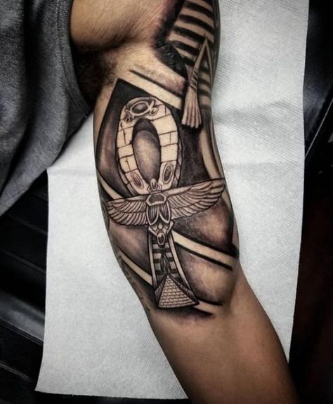 70 Ankh Tattoos: Modern Take on an Ancient Symbol | Art and Design Ankh Tattoos, Egyptian Sleeve, African Warrior Tattoos, Egypt Tattoo Design, Egyptian Eye Tattoos, Ankh Tattoo, Africa Tattoos, Inner Bicep Tattoo, Egyptian Tattoo Sleeve